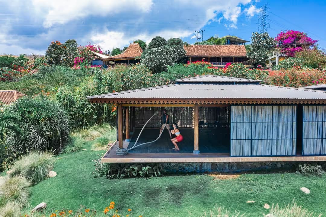 Aerial drone view of the yoga pavilion surrounded by tropical nature