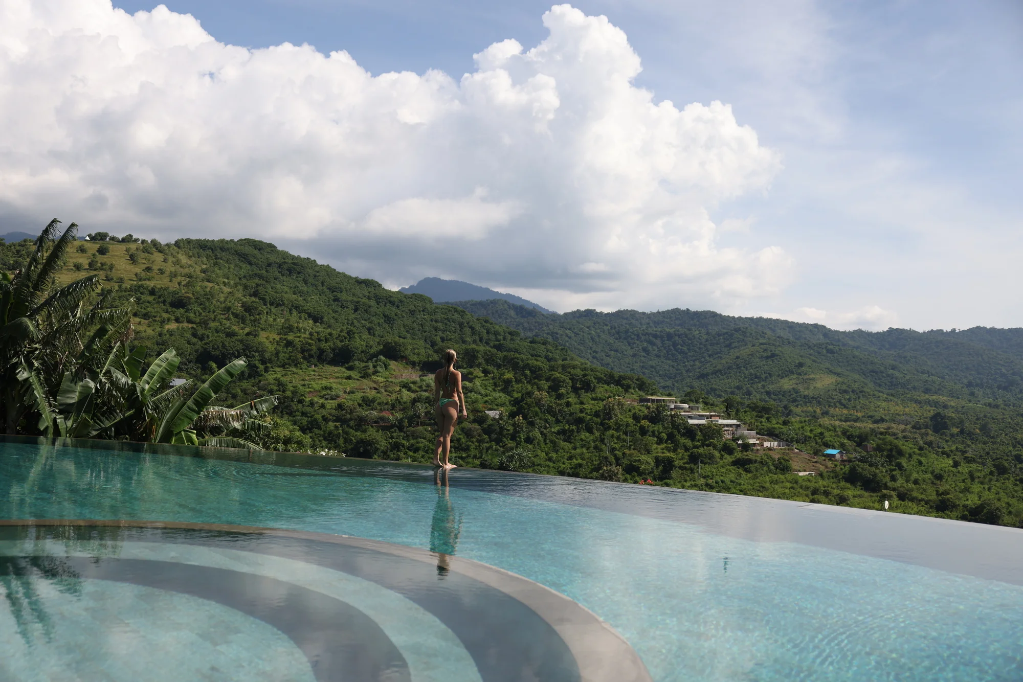 Stunning aerial view of the infinity pools at Sumberkima Hill