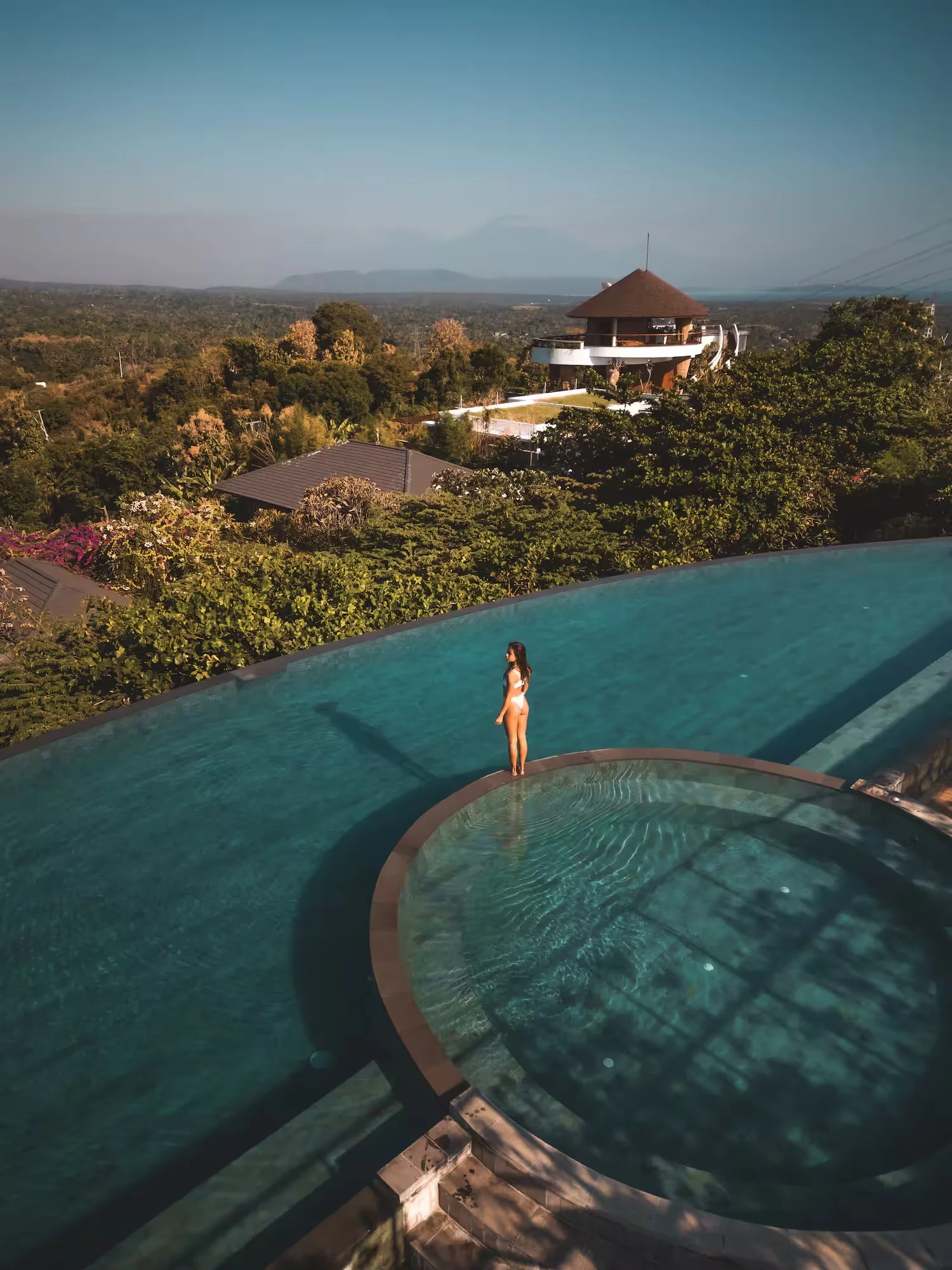 Aerial view of Madya pool with dramatic volcano backdrop