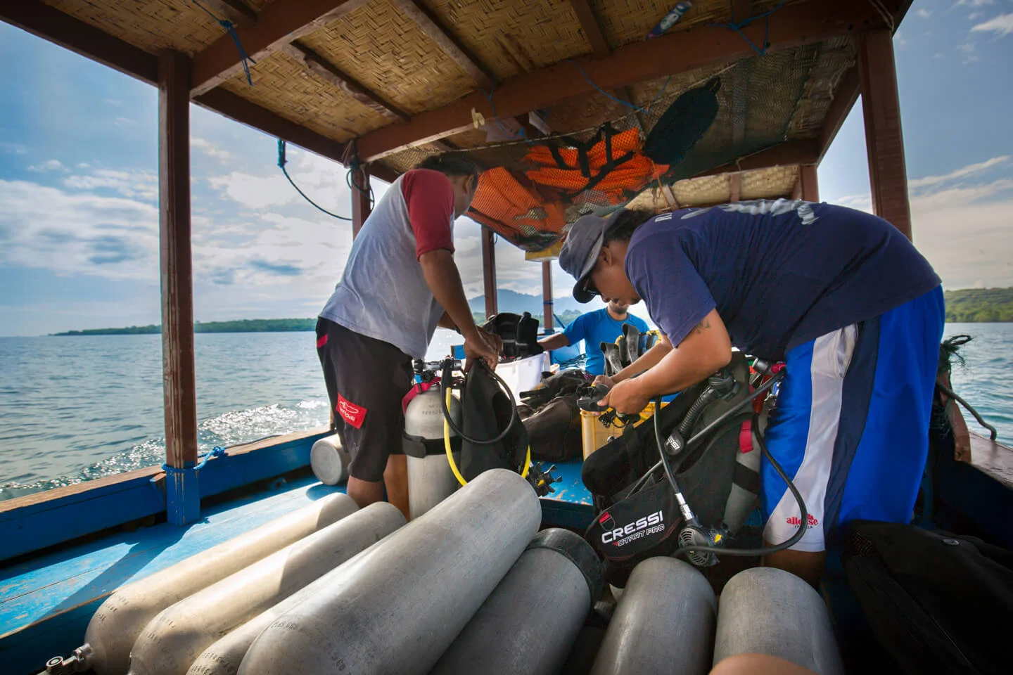 Explorer swimming through vibrant coral garden underwater