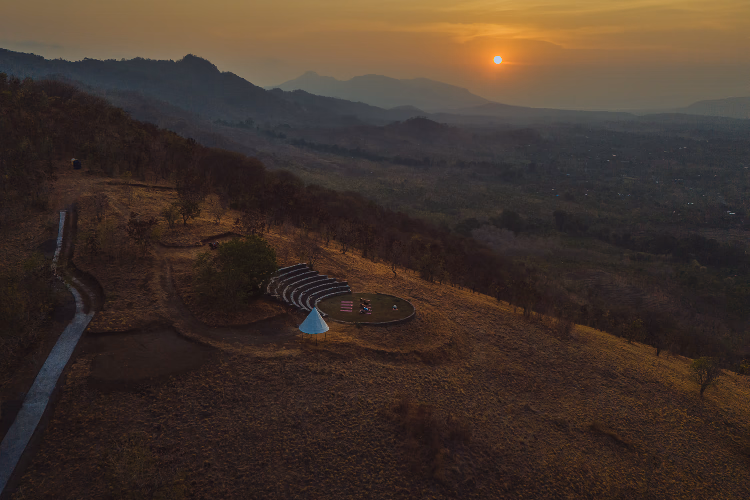 Sunset yoga at Sumberkima Stage with panoramic hill and volcano views