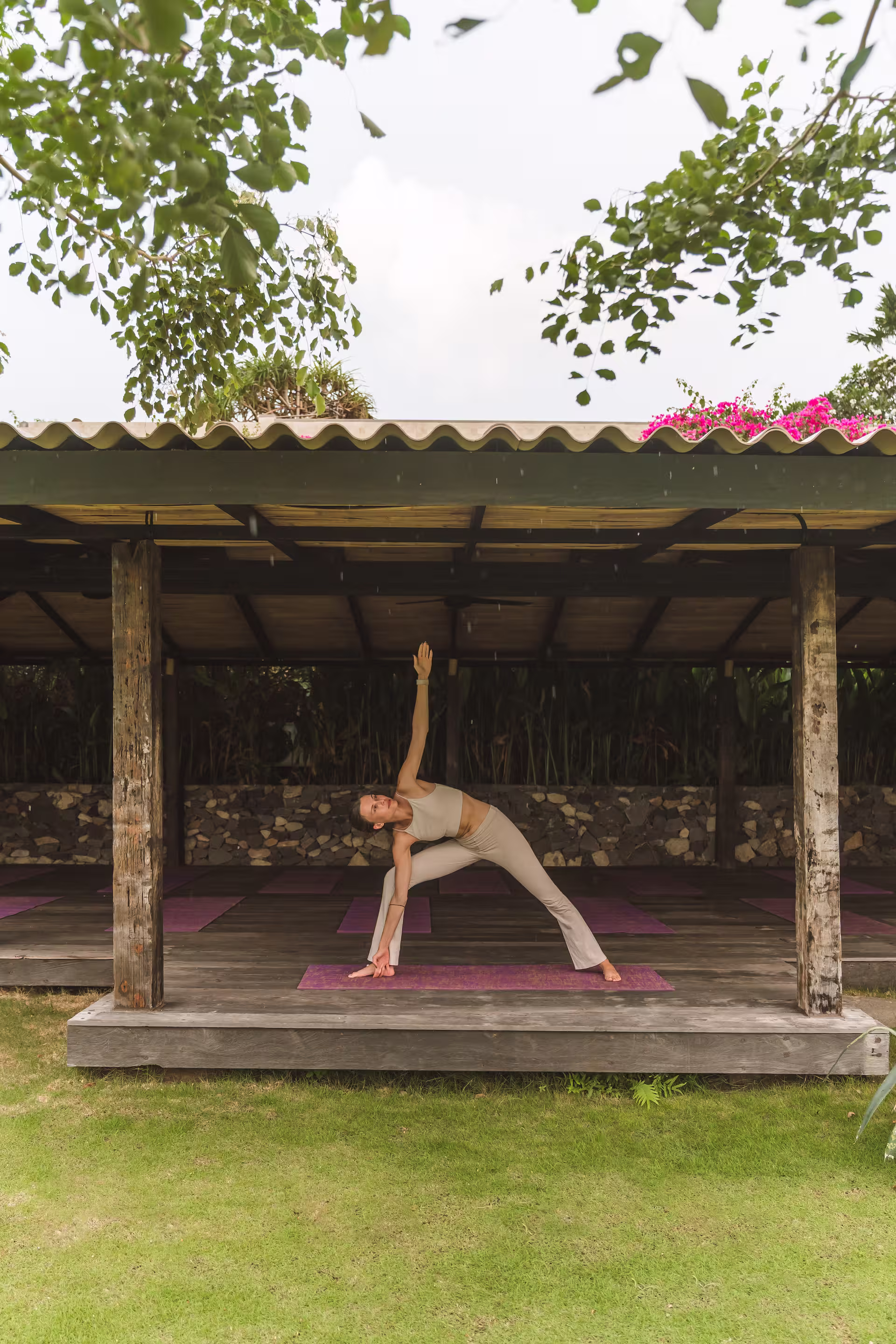 Individual yoga posture practice with instructor guidance